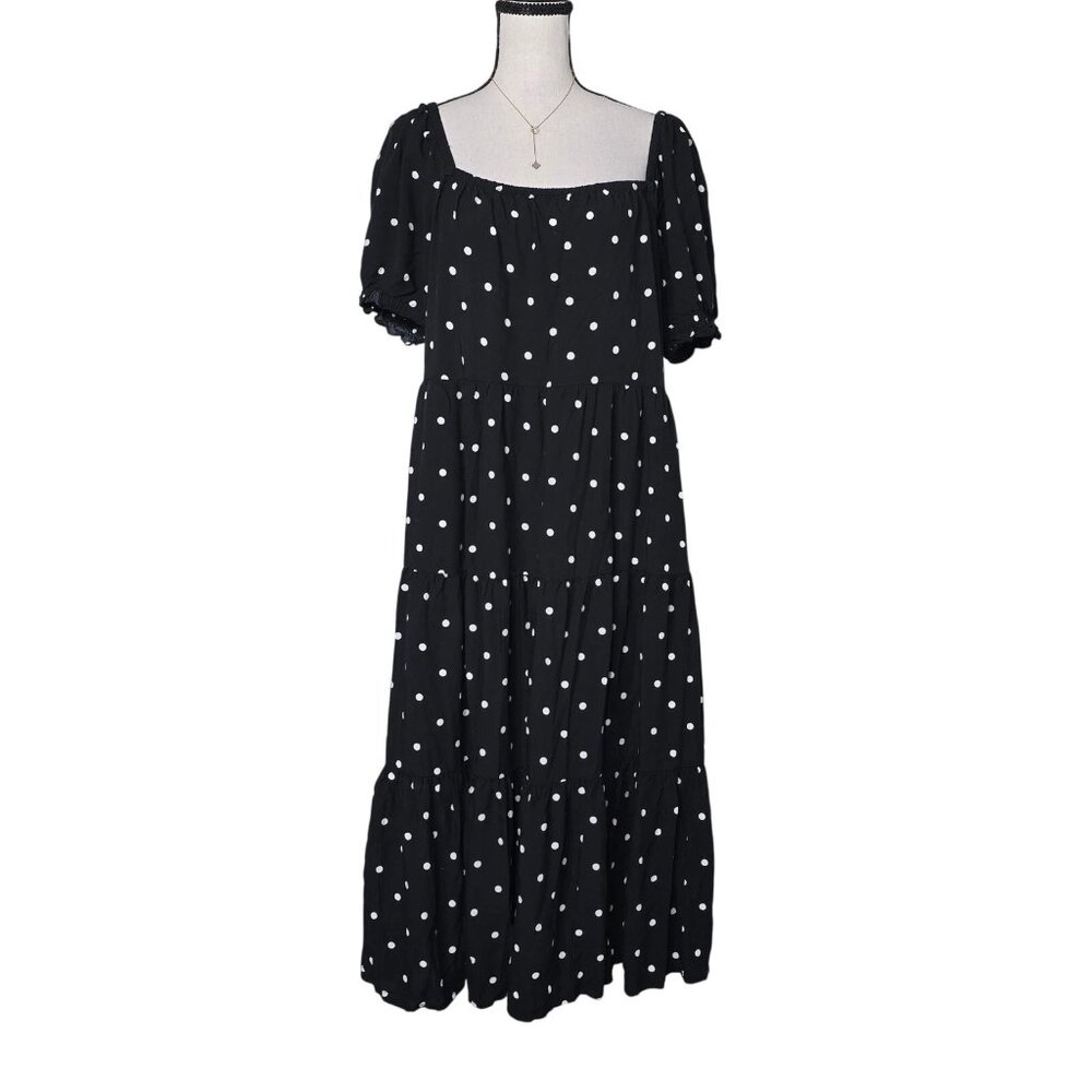 The black mid-length dress from the J.Crew brand, featuring a star pattern